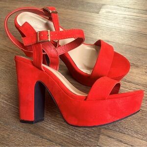 Red faux suede heels Size: 8.5. Brand New in their box.